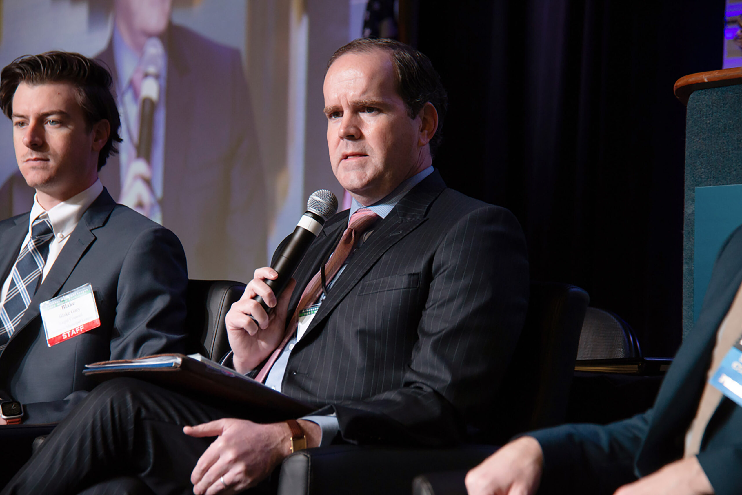 League General Counsel John Wilkerson speaks from a panel.