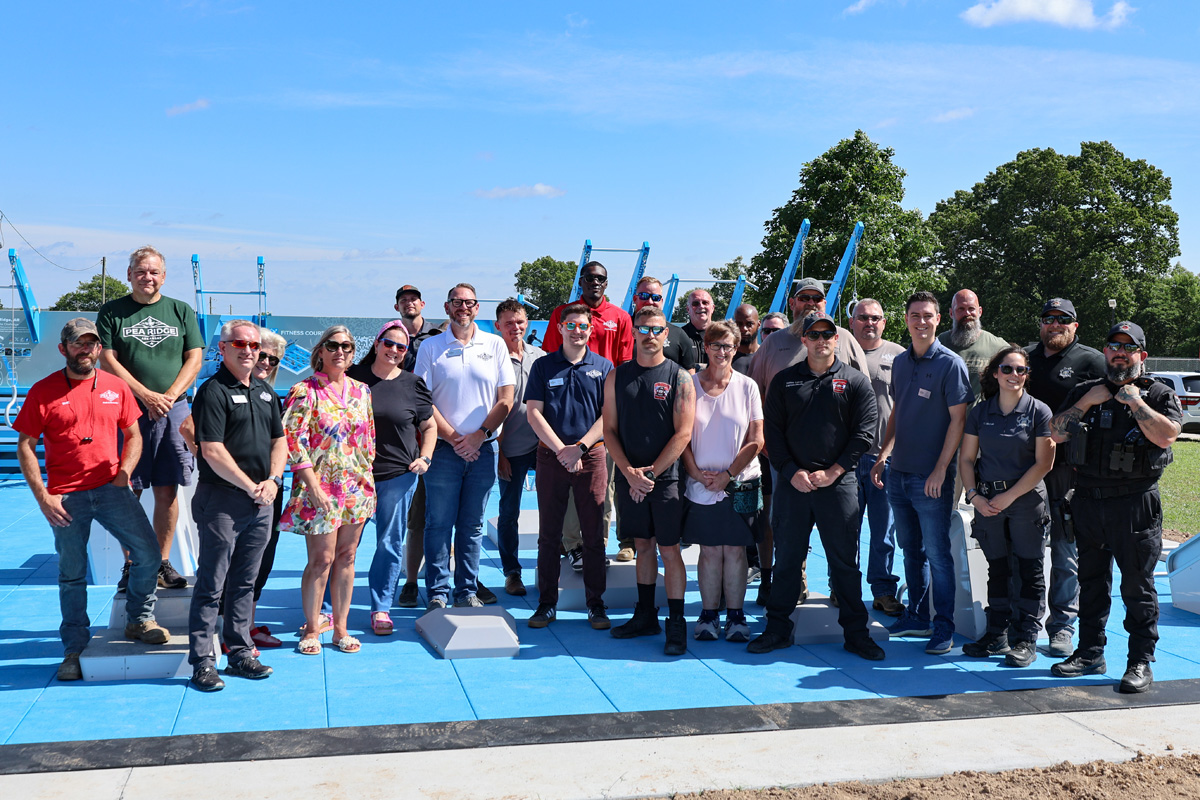A group of Pea Ridge city officials celebrated the opening of a new fitness court in July.